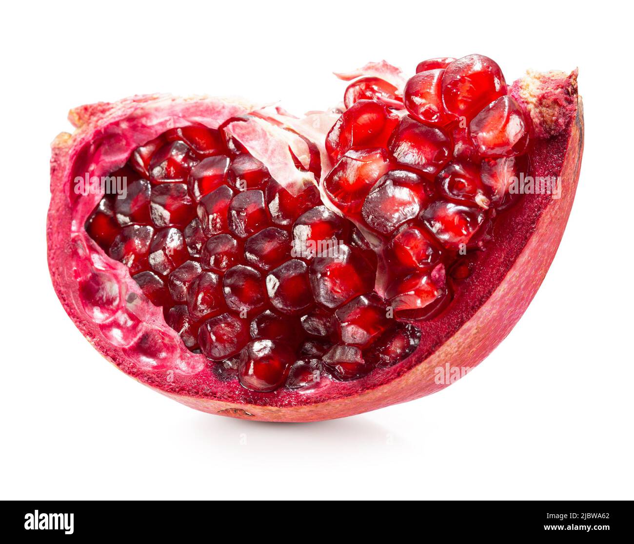 pomegranate slice with red seeds isolated on a white background with clipping path. Stock Photo