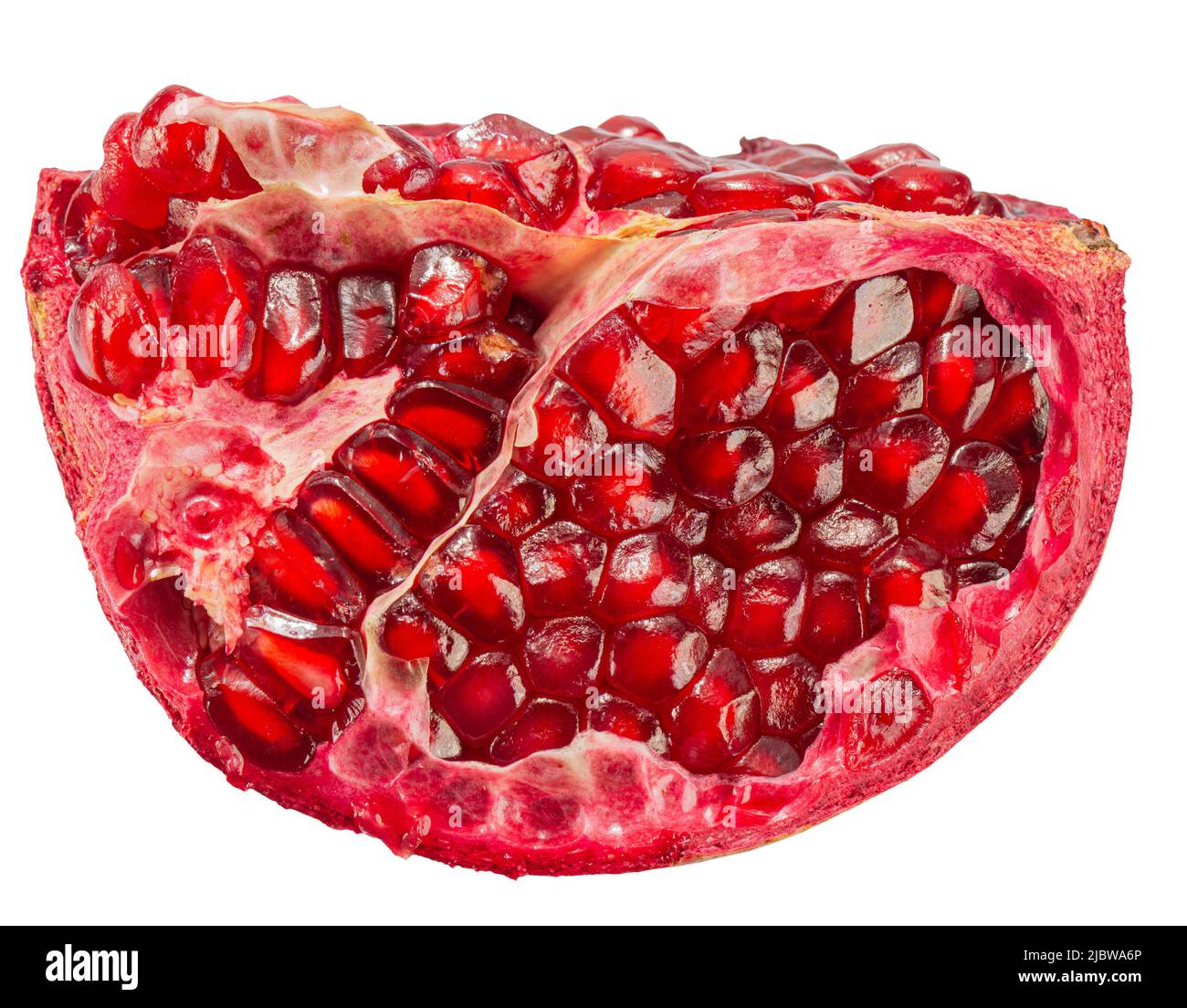 pomegranate slice with red seeds isolated on a white background with clipping path. Stock Photo
