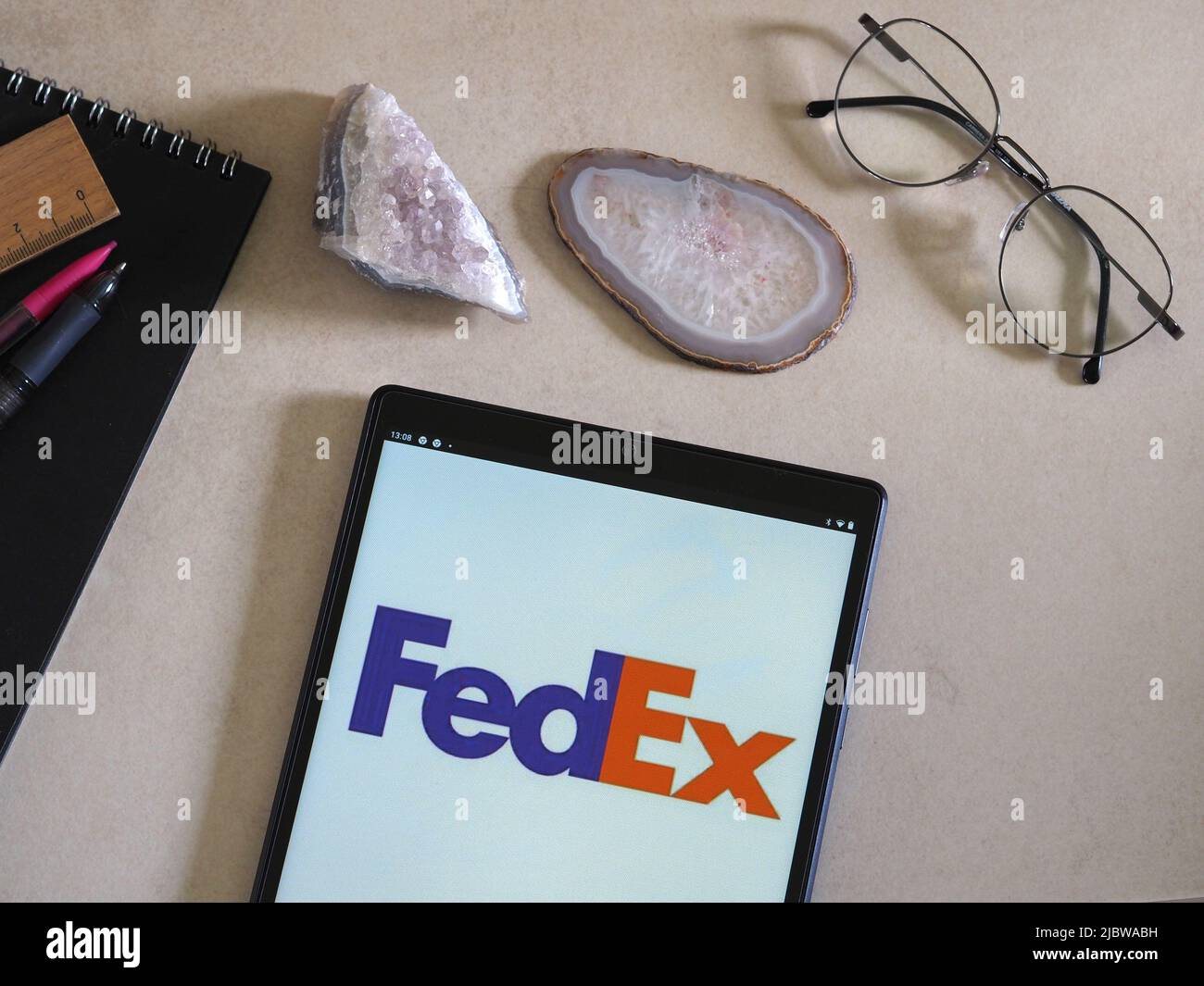 In this photo illustration FedEx Corporation logo seen displayed on a tablet Stock Photo