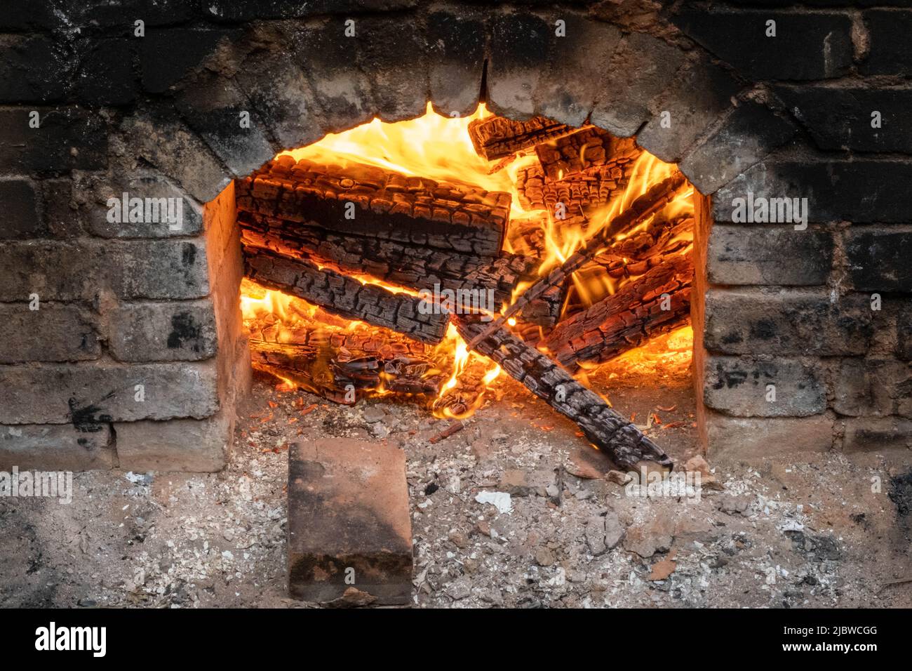 Firing of wood fire kiln is part of process for black pottery. Unique ...