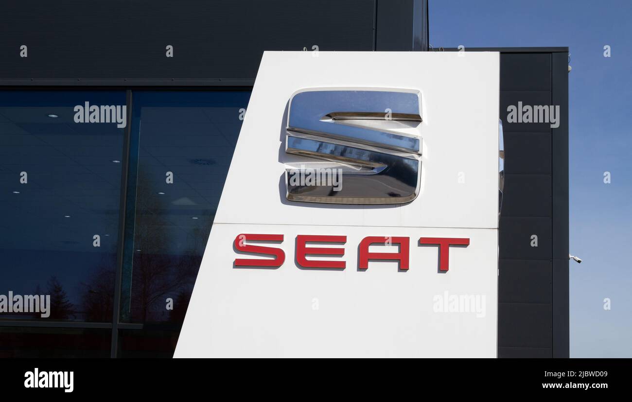 SEAT company logo, Spanish car manufacturer sign. Dealership signboard with brand logotype in Krakow, Poland. Stock Photo