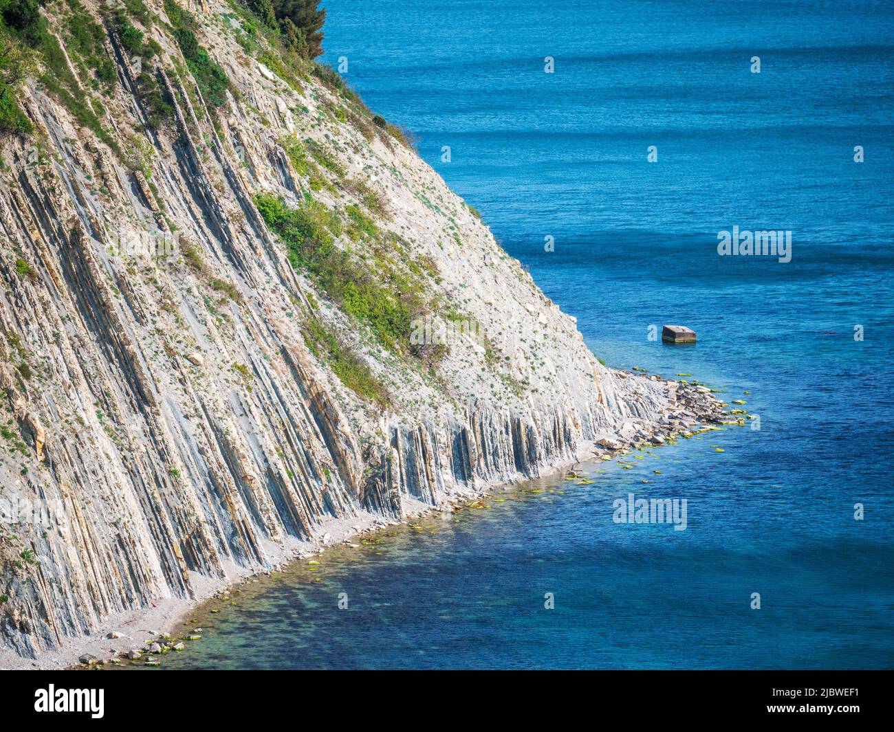 Calm turquoise water near rocky hi-res stock photography and images - Alamy
