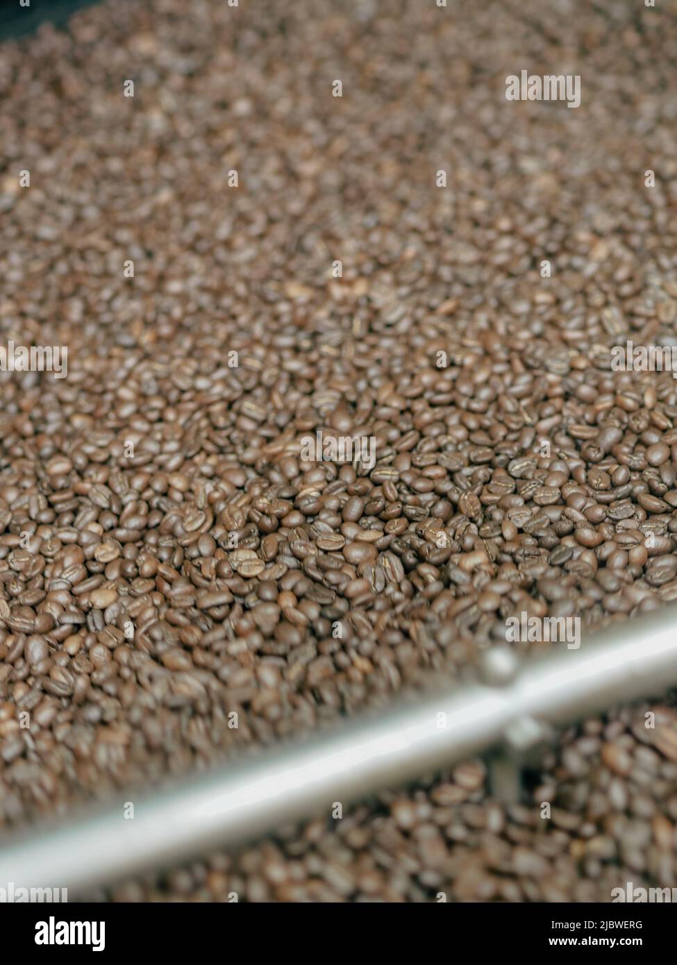 brown roasted coffee beans macro closeup Stock Photo - Alamy