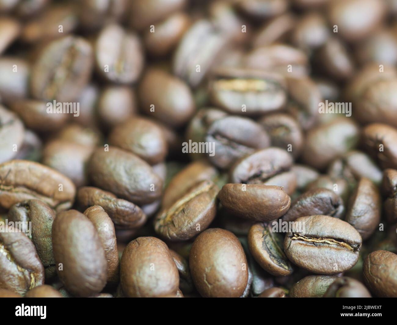 brown roasted coffee beans macro closeup Stock Photo - Alamy