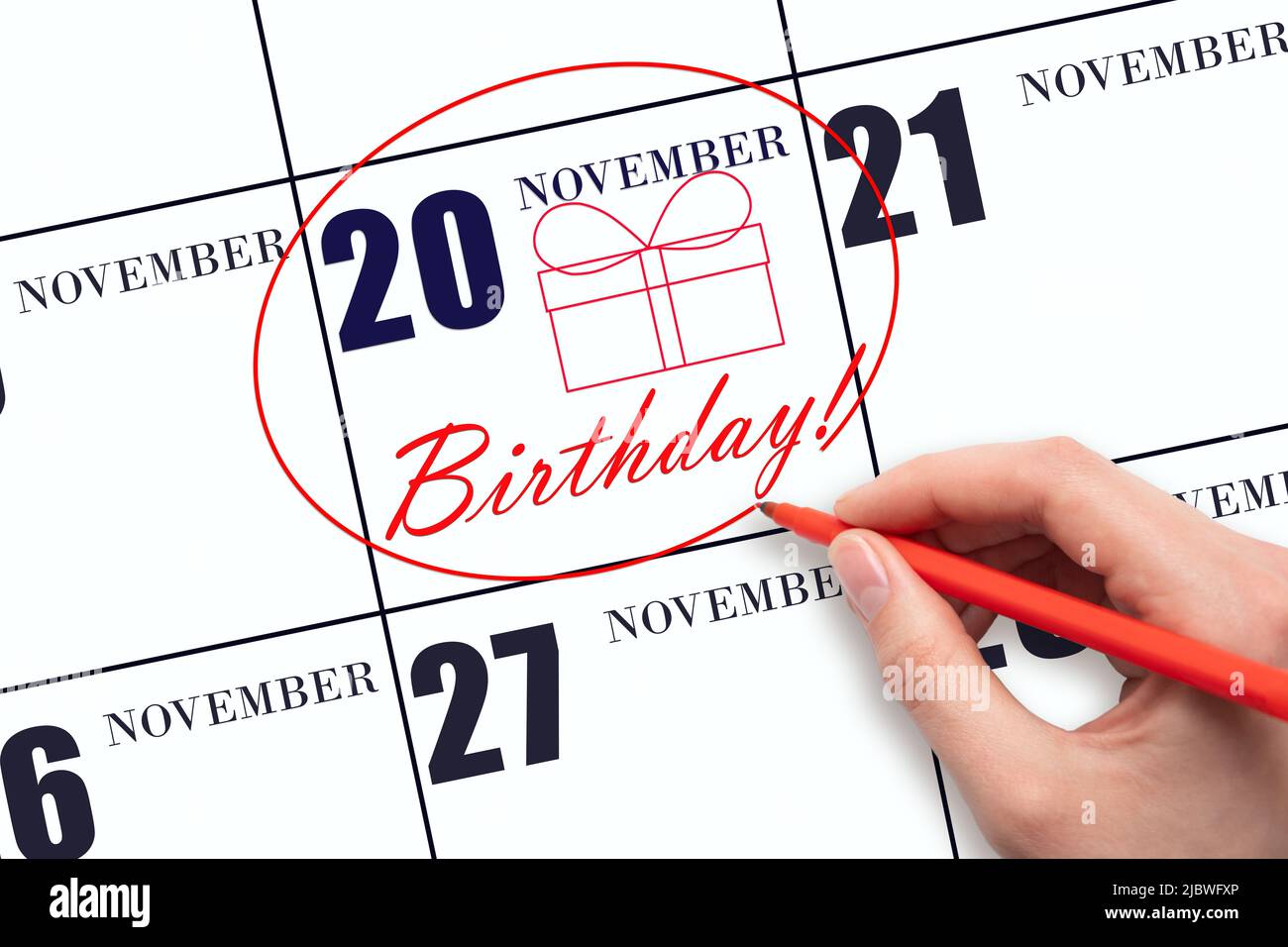 20th day of November. The hand circles the date on the calendar 20 November, draws a gift box and writes the text Birthday. Holiday. Autumn month, day Stock Photo - Alamy