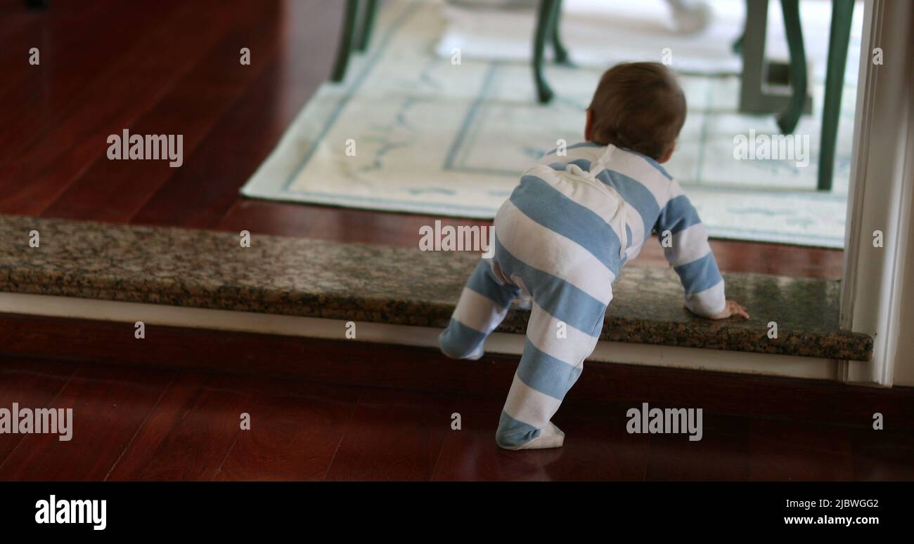 Baby toddler descending home step. infant learning development Stock ...