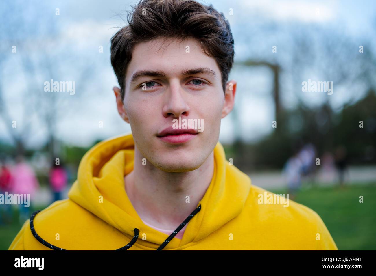 Portrait of young man with clear eyes in the park Stock Photo Alamy