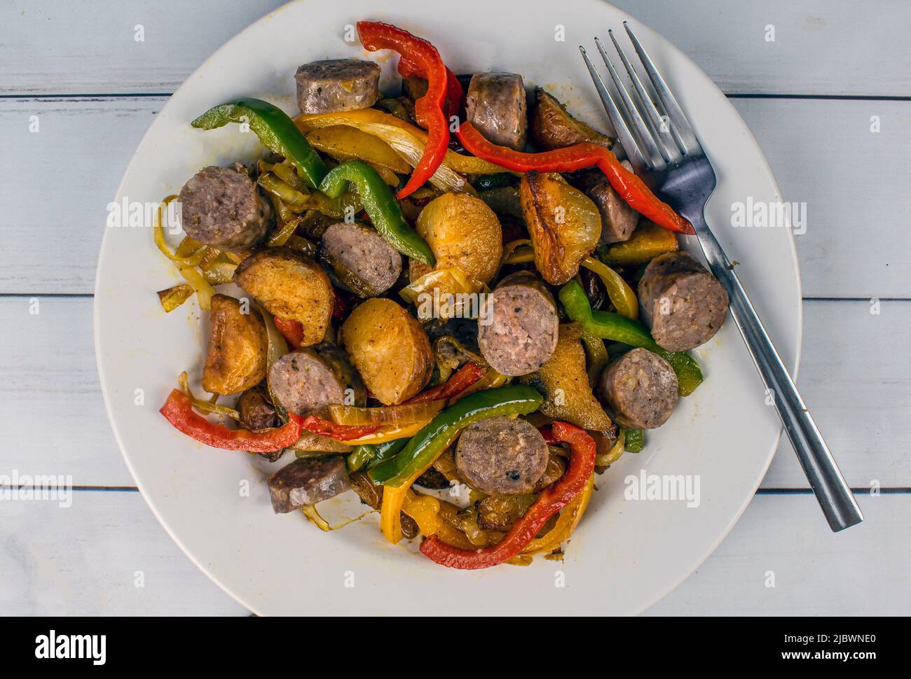 sweet italian sausage with red roasted potatoes served with sauteed