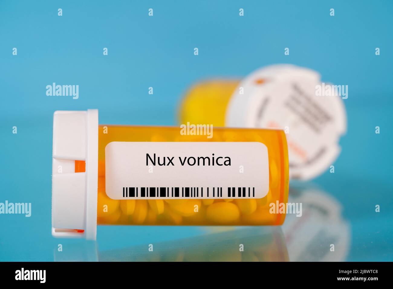 Nux vomica. Nux vomica pills in RX prescription drug bottle Stock Photo