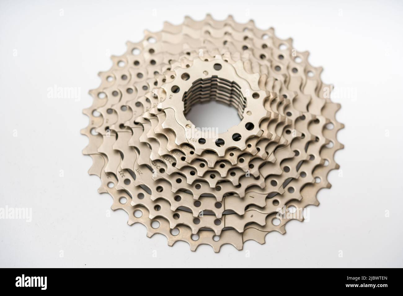 Gears, sprockets and chain of a mountain sports bike on a white