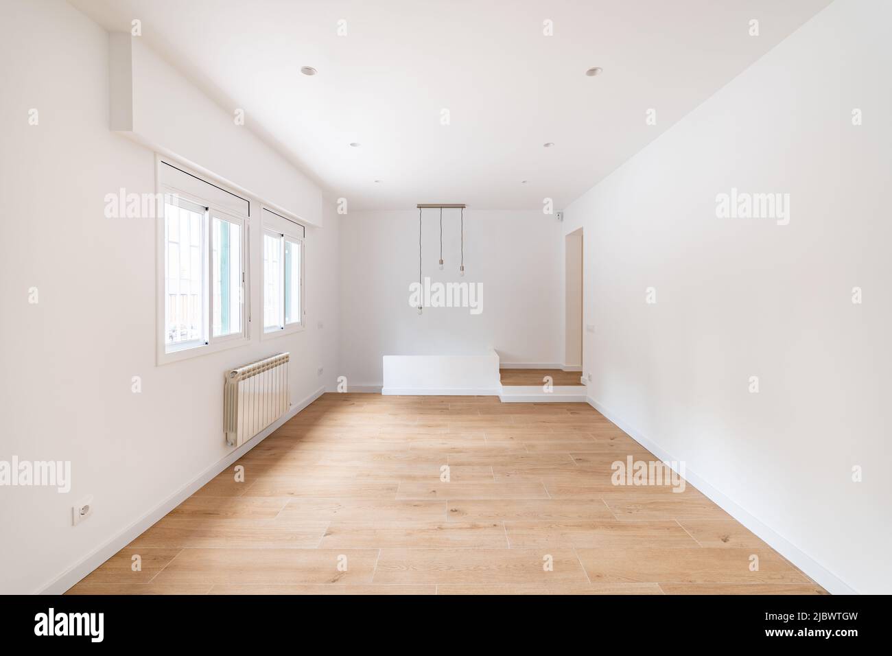 Empty apartment room with wooden floor in a new flat for rent Stock Photo