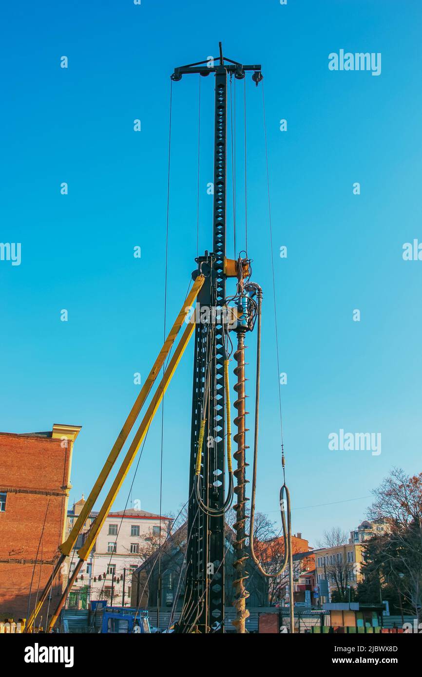 Hydraulic drilling rig. Installation of bored piles with a casing ...