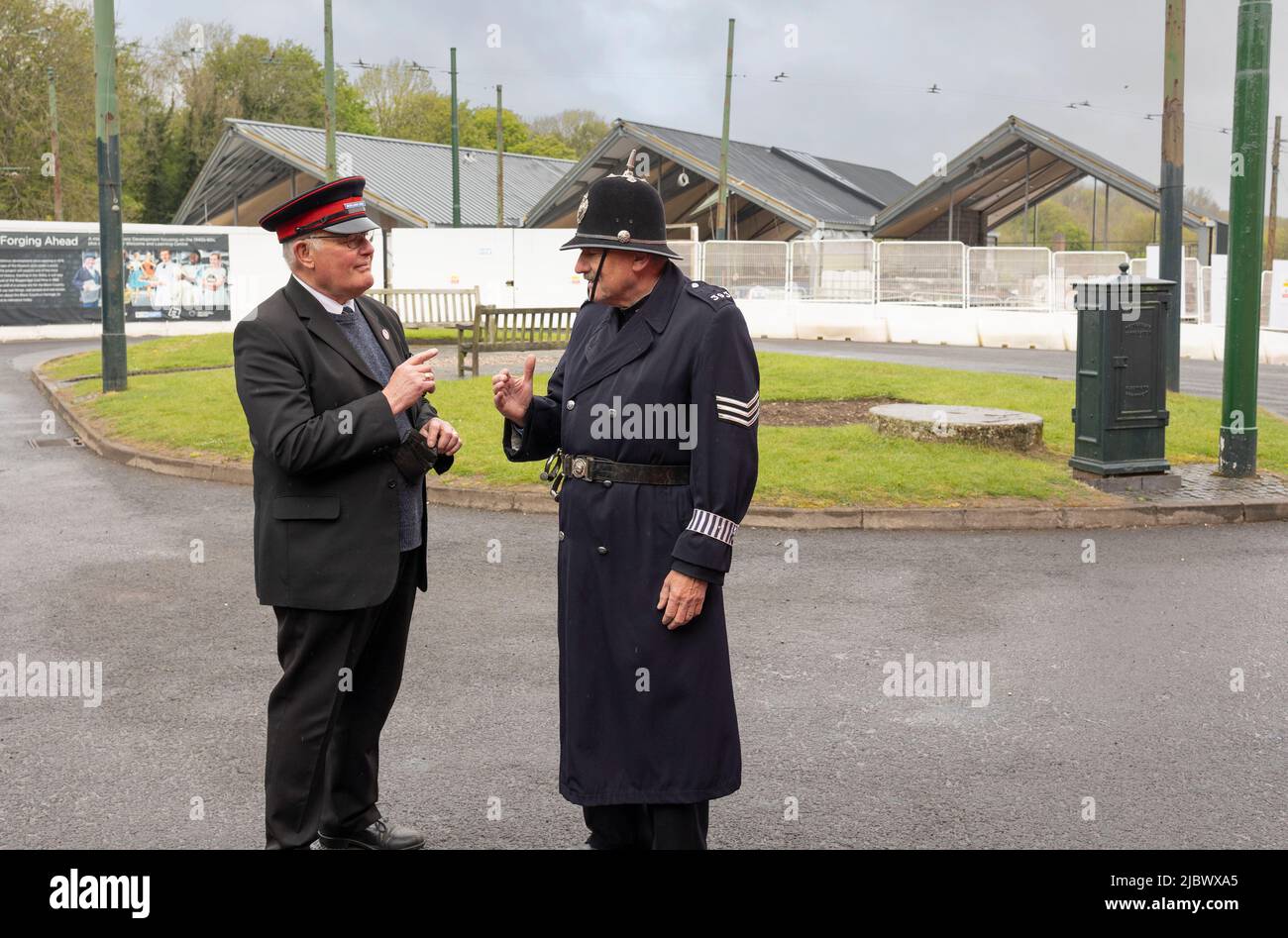 Dudley, West Midlands-United Kingdom July 13, 2019, police sergeant talking to a 1940's bus conductor Stock Photo