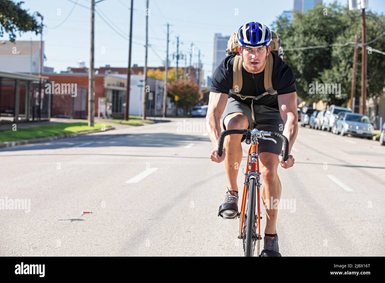 Bike Messenger out on the road for a delivery Stock Photo