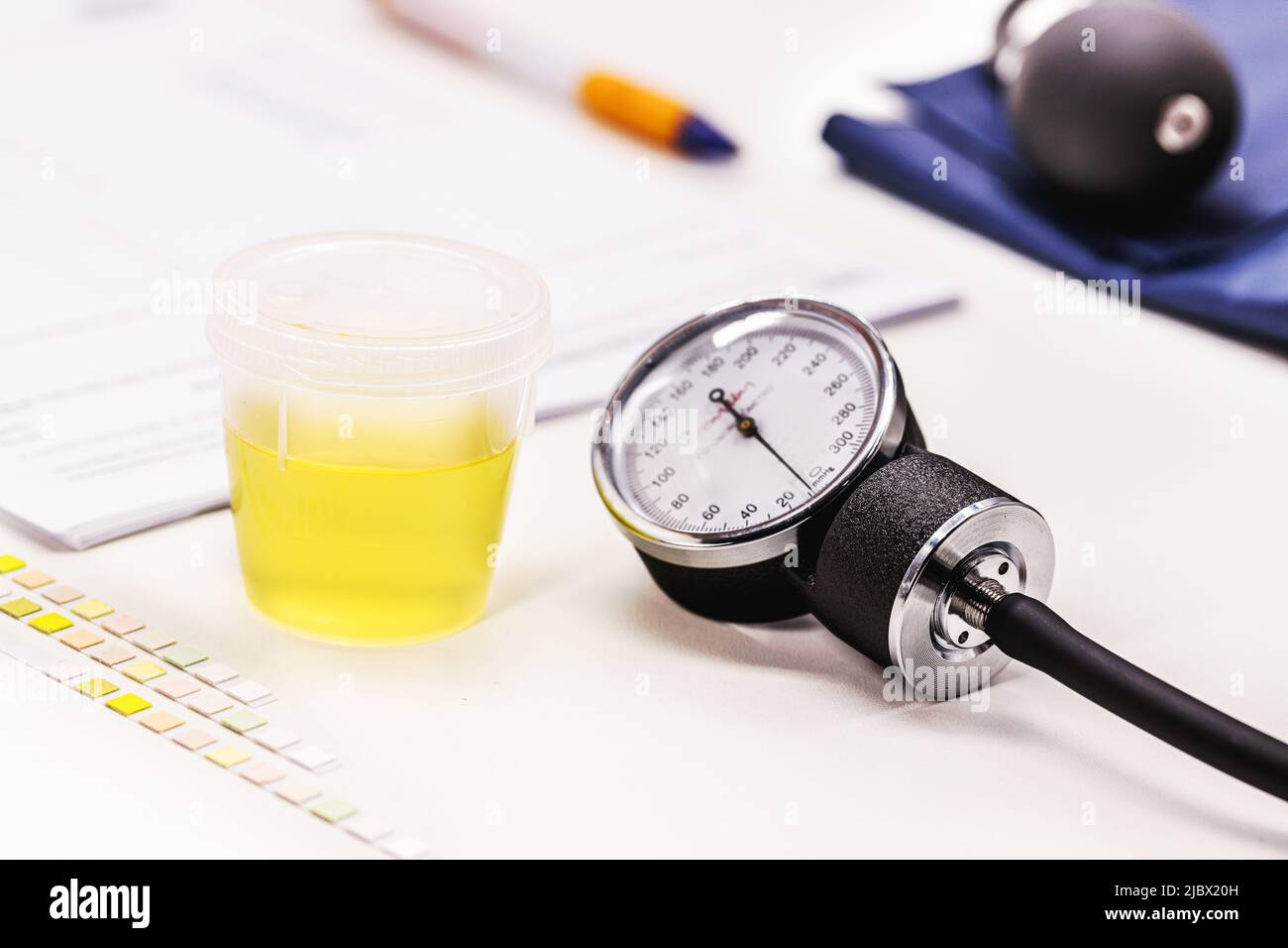 hypertension measuring device with urine bottle, next to it