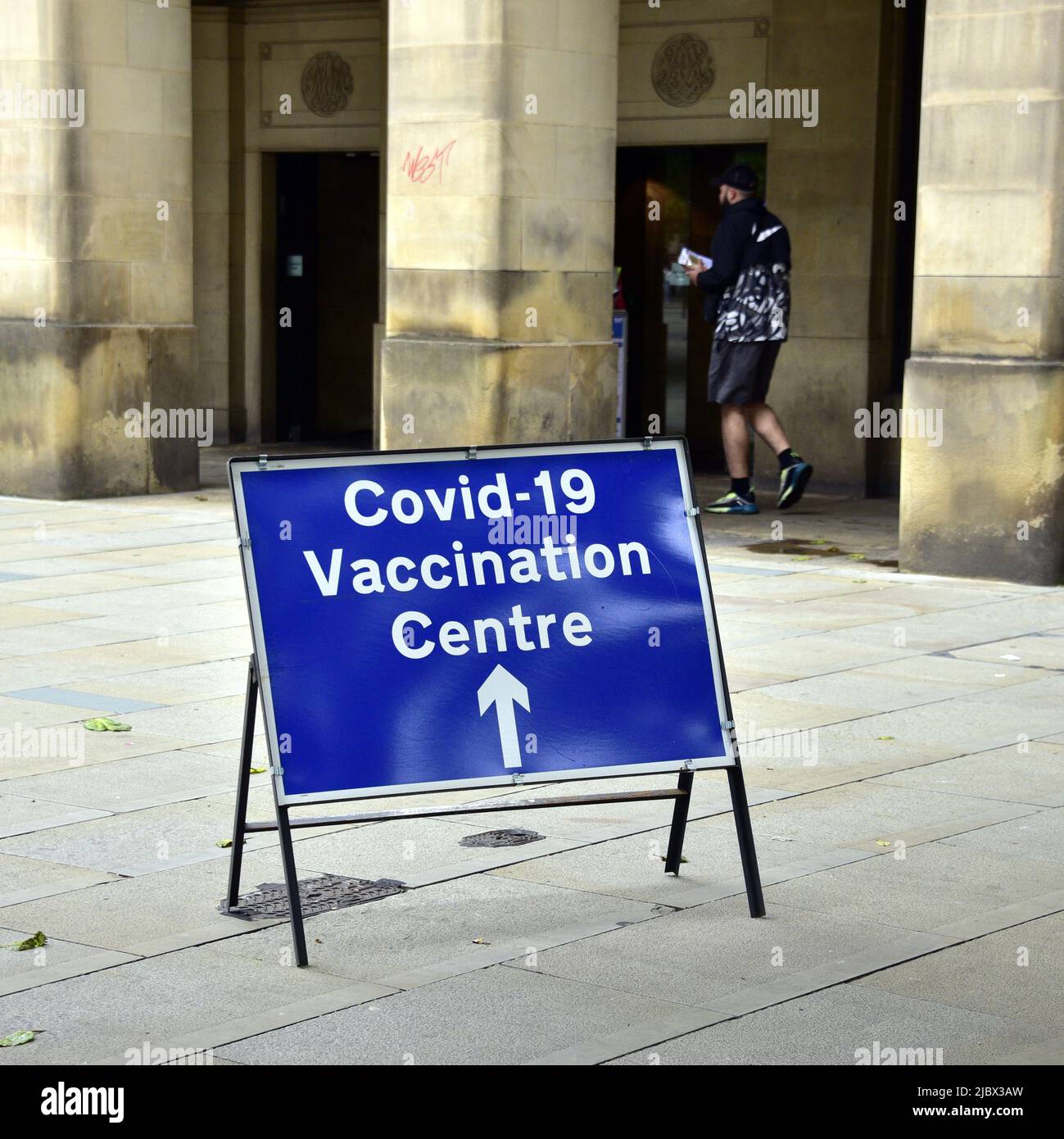 Sign for walk in centre to get vaccine to protect against Covid-19 or Covid or Coronavirus at the Town Hall in Manchester, England, United Kingdom. Stock Photo
