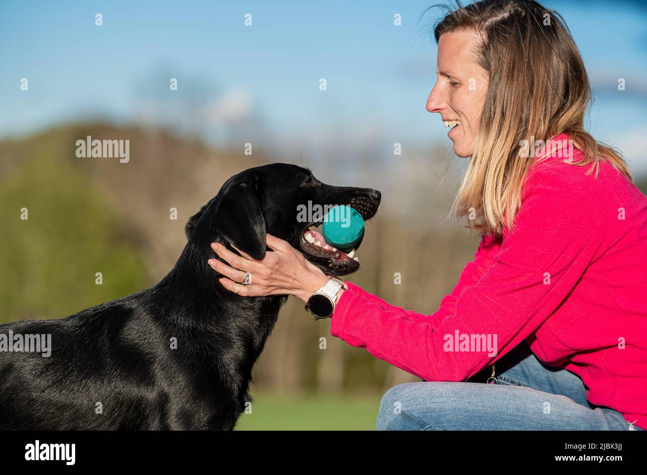Beautiful relationship between a woman ad her dog owner praising her