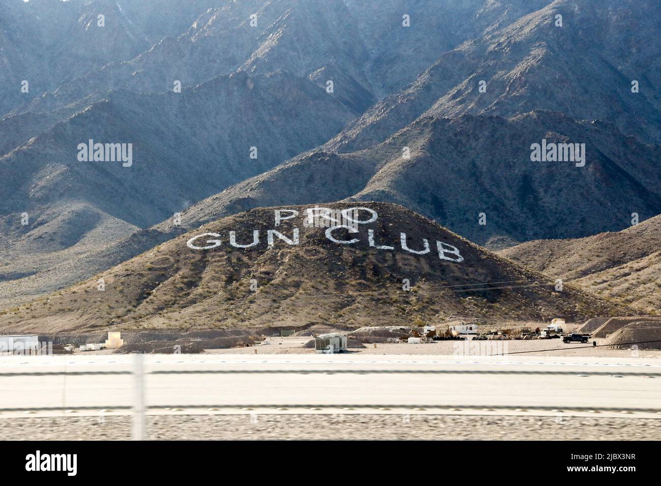 USA. 22nd Feb, 2019. A Las Vegas shooting range advertises itself prominently on the side of a foothill that is easily seen off Highway 95 in Nevada on February 22, 2019. Pro Gun Vegas sits on 160 acres of land complete with a 5,000 square-foot clubhouse, machine gun ranges, training ranges, and target stands. (Photo by: Alexandra Buxbaum/Sipa USA) Credit: Sipa USA/Alamy Live News Stock Photo