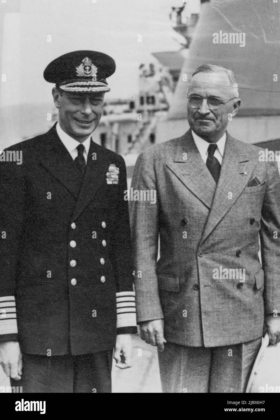 President Truman Received By The King in Plymouth Sound. Return Visit to American Warship: The King and President Truman aboard H.M.S. 'Renown'. The King received President Truman on board the battle cruiser H.M.S.'Renown' after the President had flown to England from Potsdam. His Majesty then paid a visit to the U.S. cruiser 'Augusta', visiting the President before he sailed for America. Earlier in the day after his plane landed near Plymouth, Mr. Truman saw the historic Barbican Stone and Mayflower Steps, where the Pilgrim Fathers set sail for New England. August 20, 1945. (Photo by London N Stock Photo