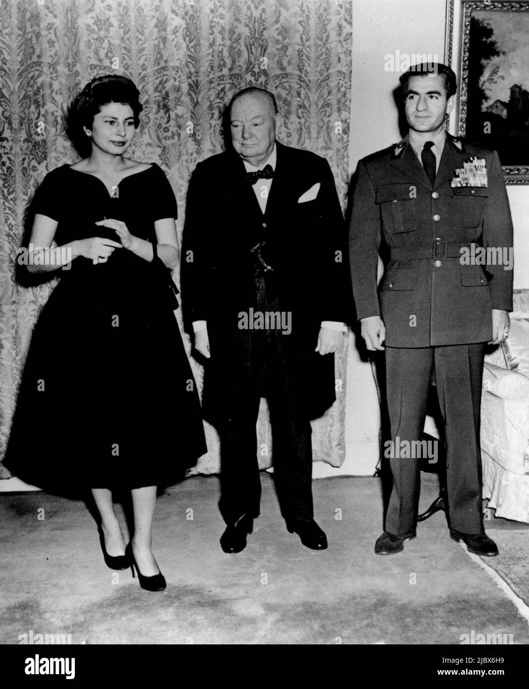 Royal Visitors to the Prime Minister -- The Shah and Queen Soraya with Sir Winston Churchill before the Luncheon. The Shah of Persia with Queen Soraya - now in London on a private visit - had Luncheon with Sir Winston Churchill at No. 10 Downing St. February 22, 1955. (Photo by Sport & General Press Agency, Limited) Stock Photo