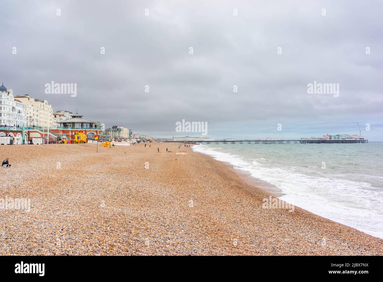 Brighton beach / seafront with view towards Brighton Palace Pier, East Sussex, England, UK Stock Photo