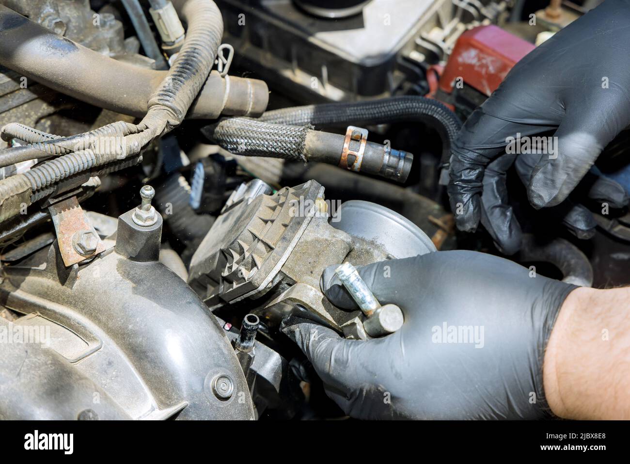 Mechanic replacement throttle body Stock Photo