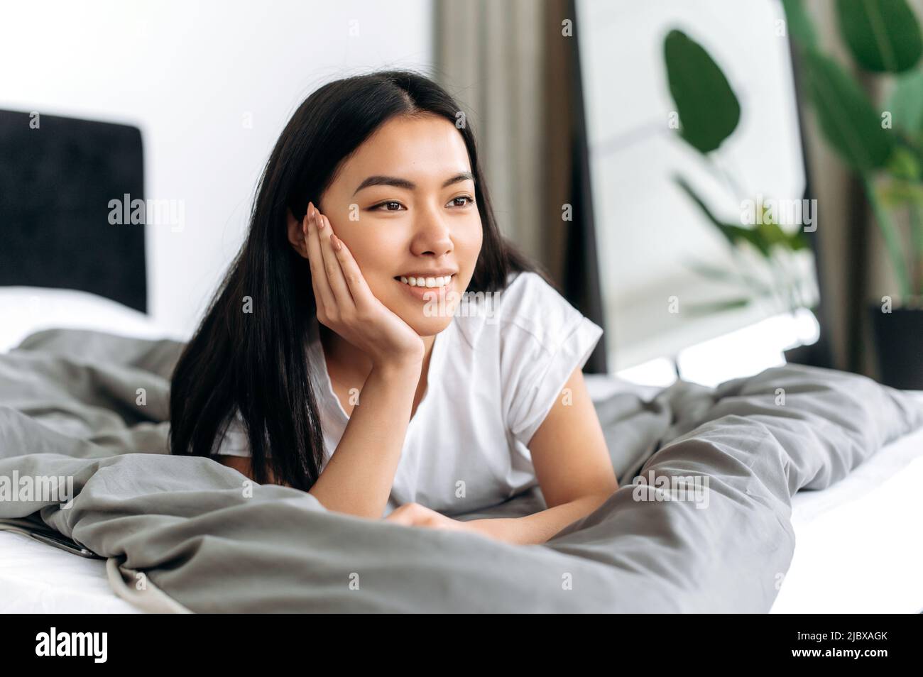 Positive lovely calm girl of Asian nationality, in a basic