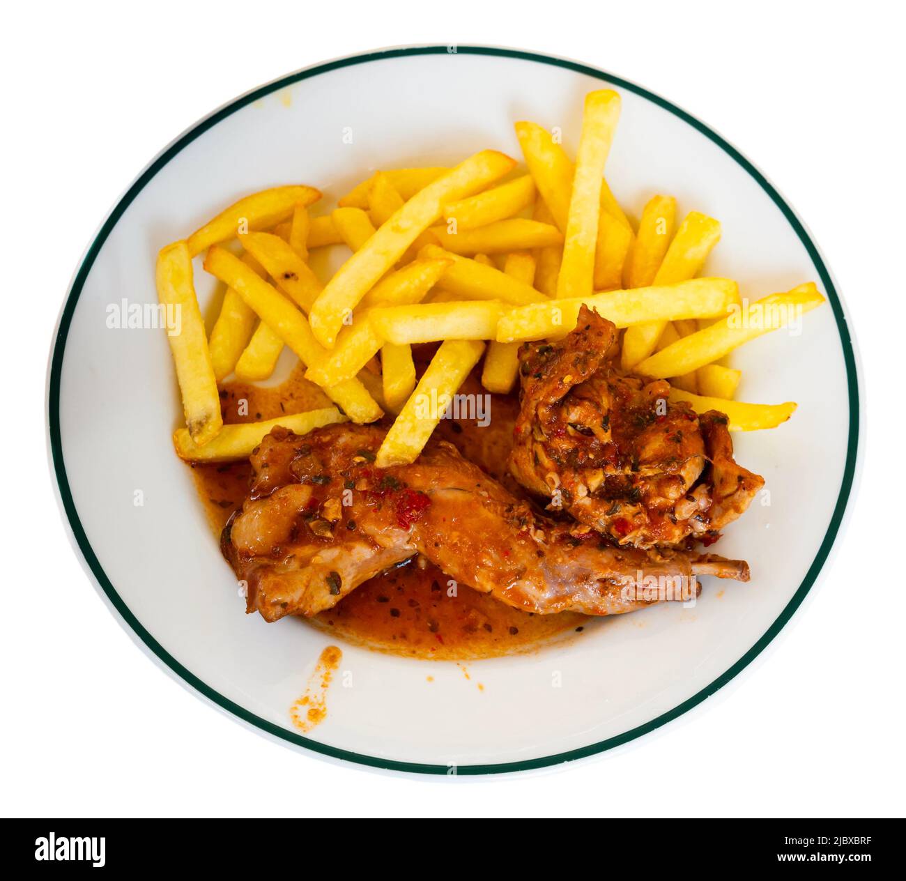 Chopped rabbit stewed in gravy with fried potatoes Stock Photo - Alamy