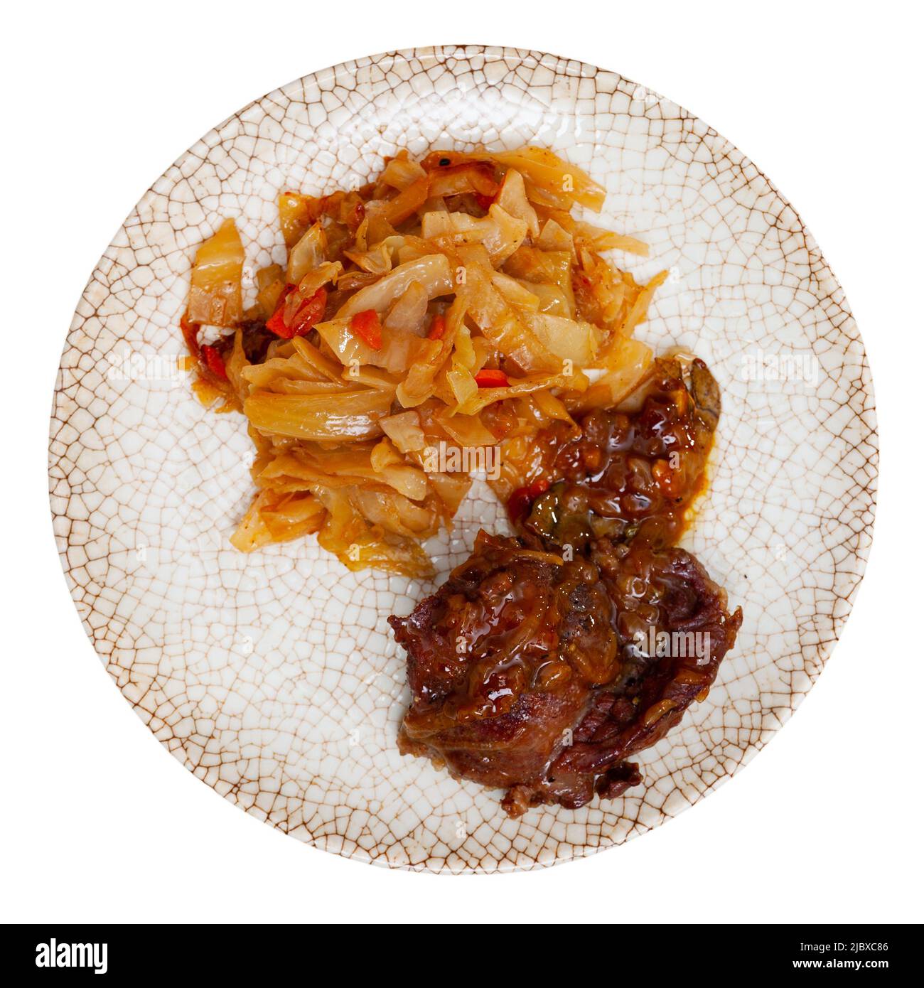 Portion of pork meat with stewed cabbage Stock Photo