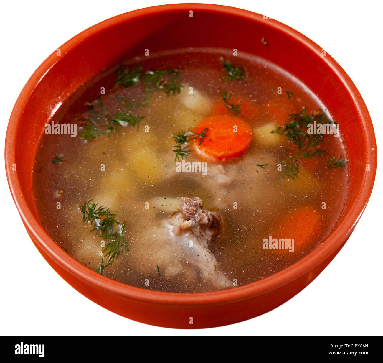 Bowl with meat soup served on white Stock Photo