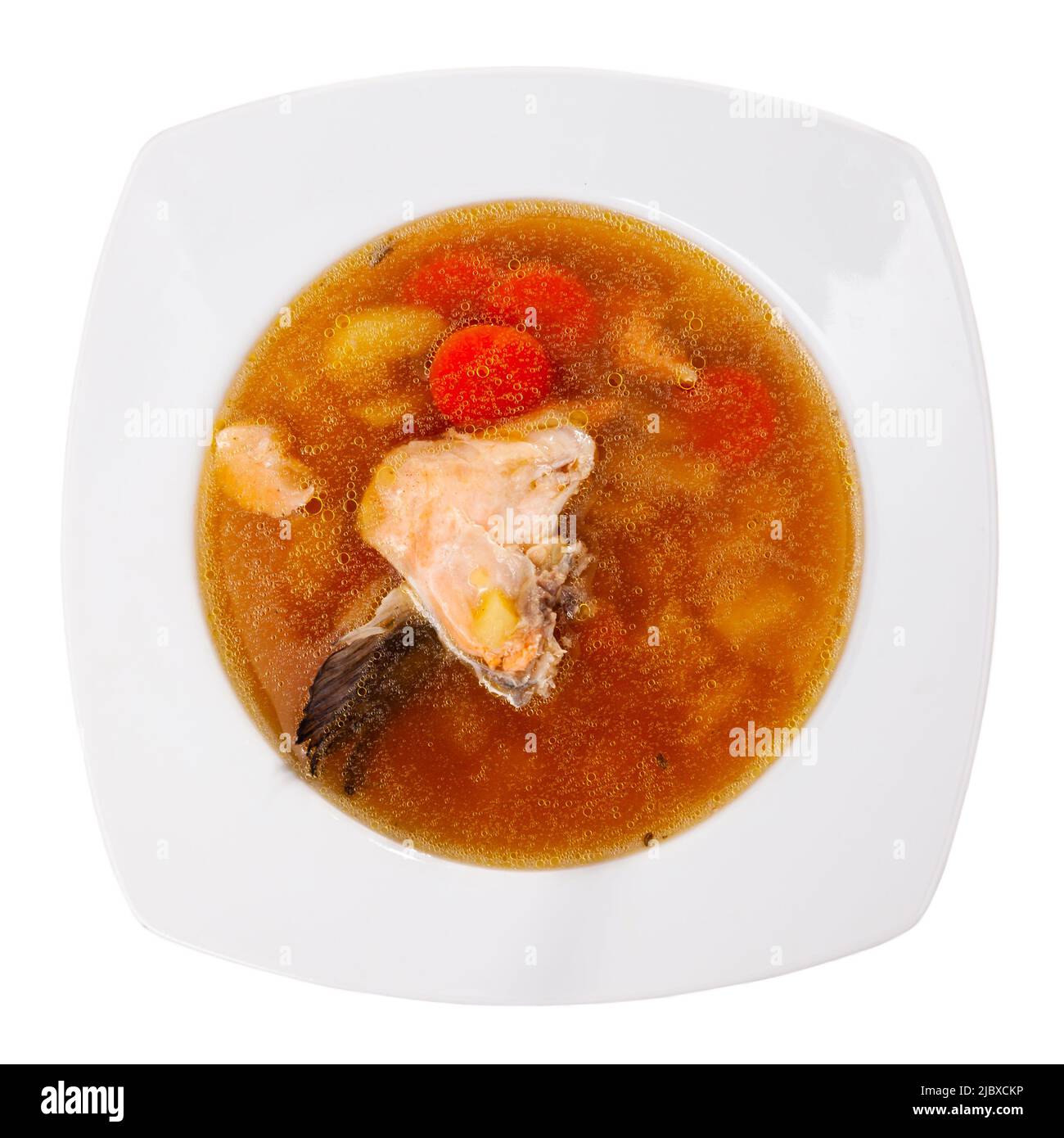 Salmon offal soup with potatoes, carrots and parsley closeup Stock Photo