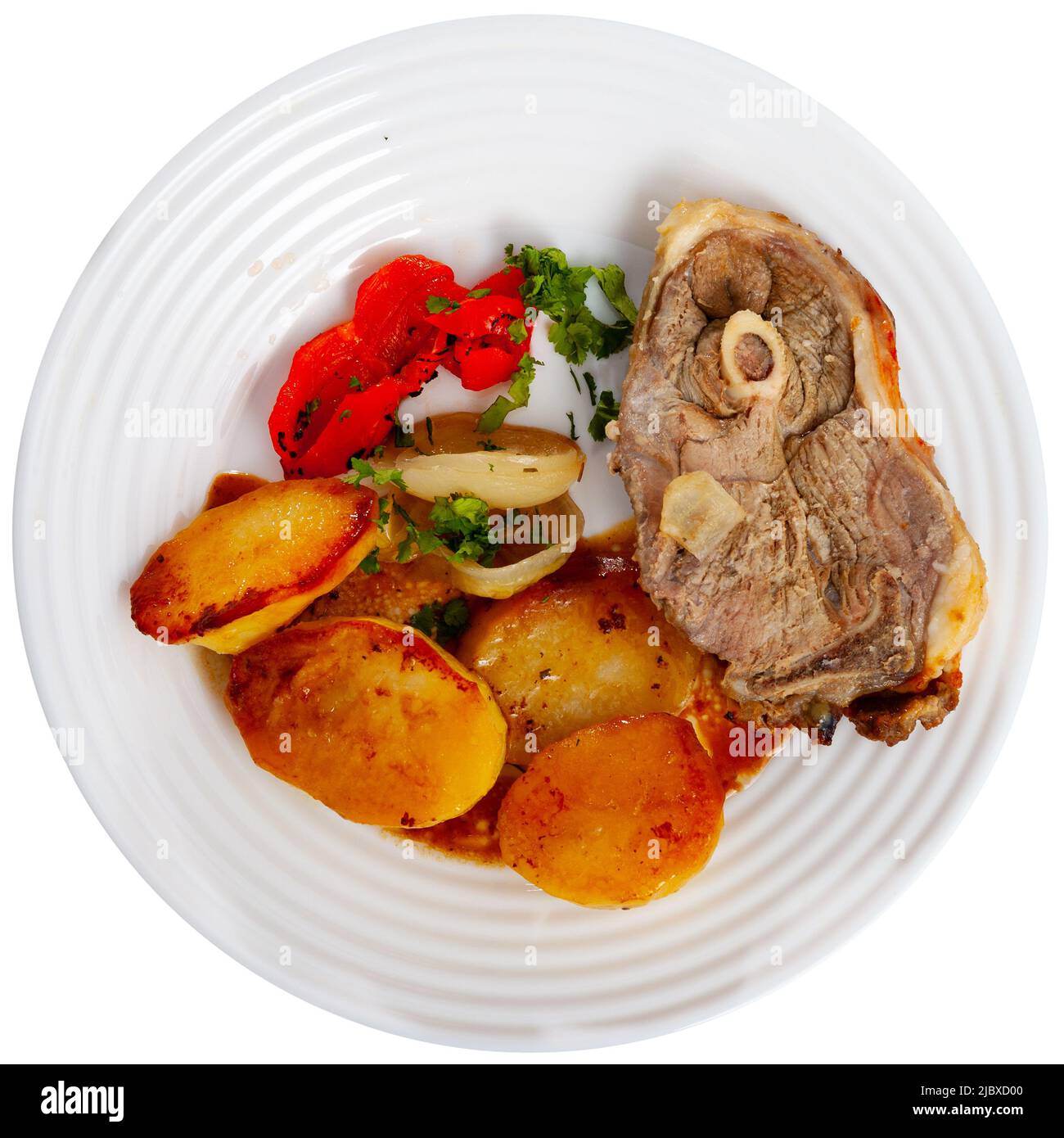 Roasted lamb leg served with grilled organic vegetable and peppe closeup Stock Photo