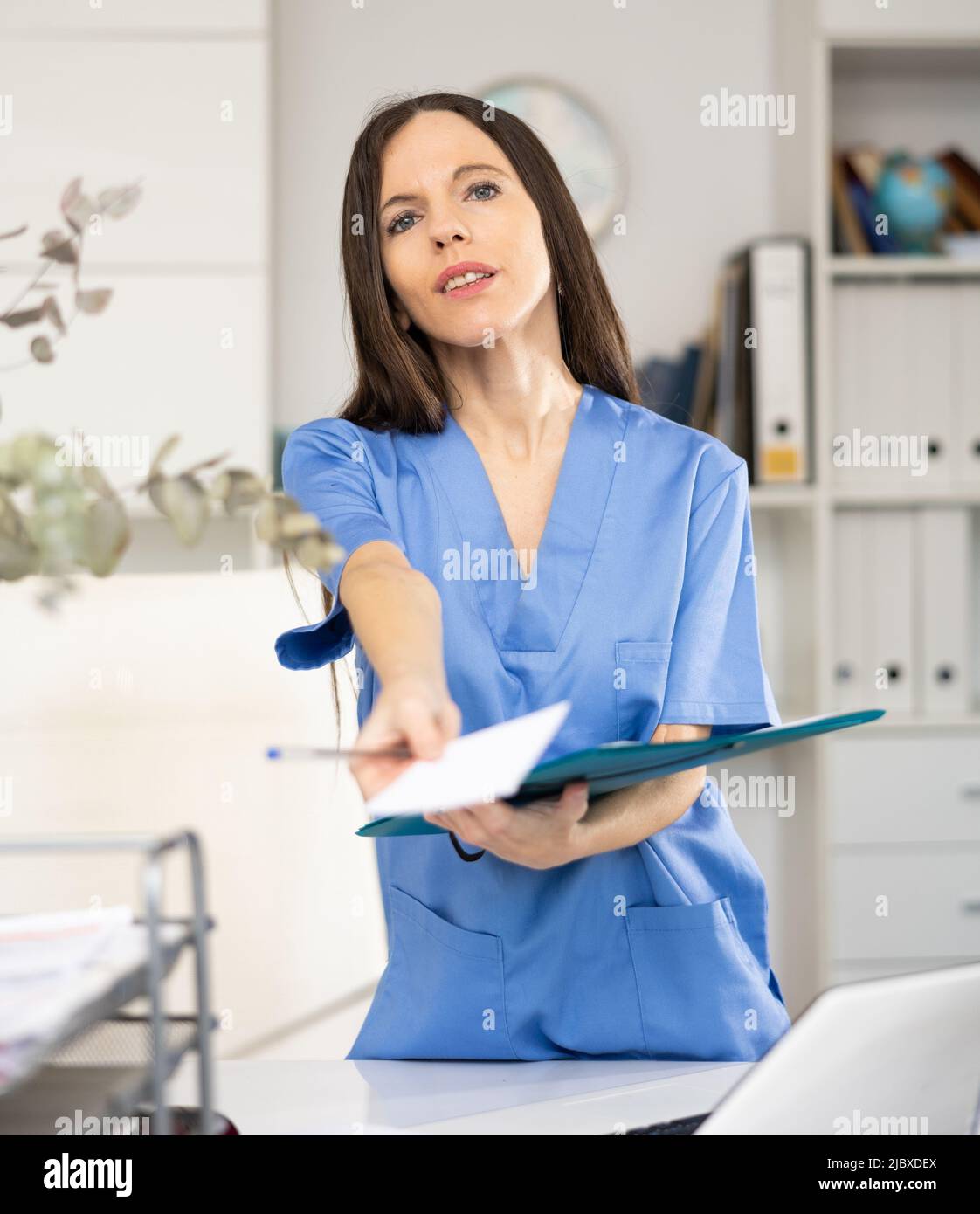 Woman physician giving recipe hi-res stock photography and images - Alamy