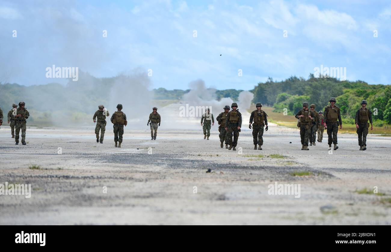 ANDERSON AIR FORCE BASE, Guam (June 7, 2022) U.S. Sailors from Explosive Ordnance Disposal Mobile Unit (EODMU) 5 along with Marines from Marine Wing Support Squadron 171 conduct an integrated airfield damage repair evolution in support of Valiant Shield 2022. Exercises such as Valiant Shield allows the Indo-Pacific Command Joint Forces the opportunity to integrate forces from all branches of service to conduct precise, lethal, and overwhelming multi-axis, multi-domain effects that demonstrate the strength and versatility of the Joint Force and our commitment to a free and open Indo-Pacific.str Stock Photo
