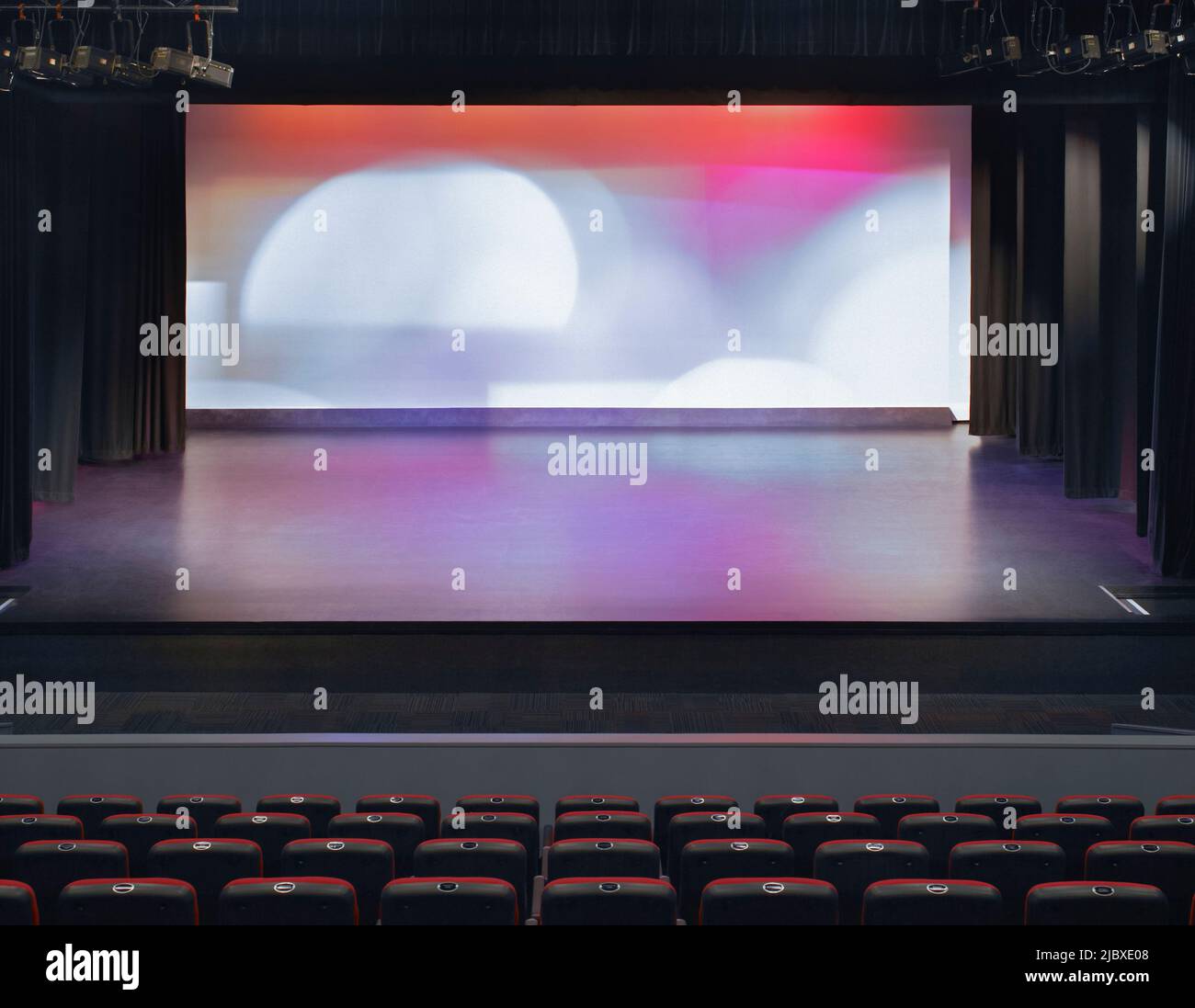 Spotlights shining on stage in theatre Stock Photo Alamy