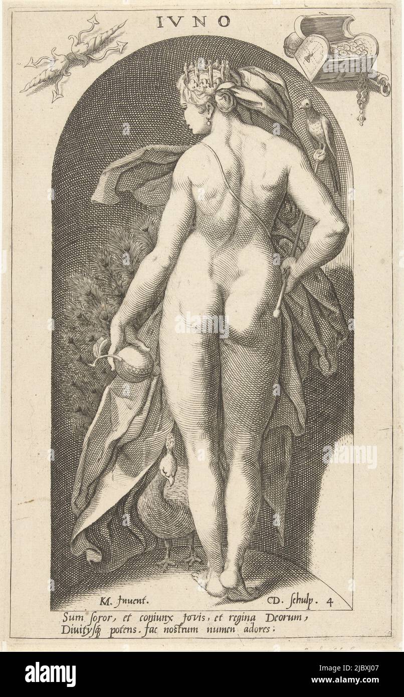 A statue of the goddess Juno with her peacock, placed in a niche. Juno holds a pomegranate and a scepter with a cuckoo in her hands. On her head she has a crown. With a Latin caption, Juno with Peacock Ivno (title on object) Antique Gods (series title), print maker: Cornelis Jacobsz. Drebbel, (mentioned on object), Karel van Mander, (mentioned on object), Cornelius Schonaeus, (attributed to), print maker: Netherlands, Haarlem, 1598, paper, engraving, h 268 mm × w 163 mm Stock Photo