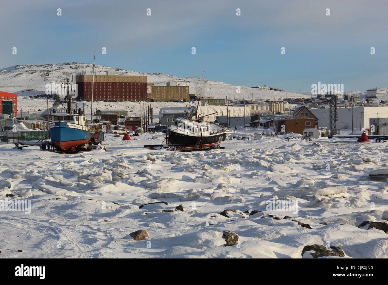 Photo taken in Iqaluit, Nunavut, Canada on January 31 2021 Boat on frozen sea Stock Photo