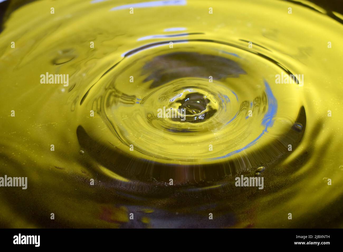Water Drop Photography, close up with yellow background Stock Photo - Alamy