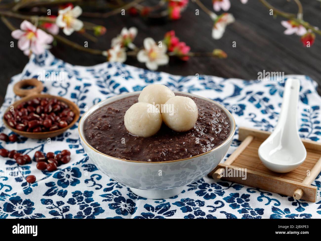 Korean Food Patjuk or Red Bean Porridge Topped with Round Rice Cake, Eat at Winter Solstice Festival Stock Photo