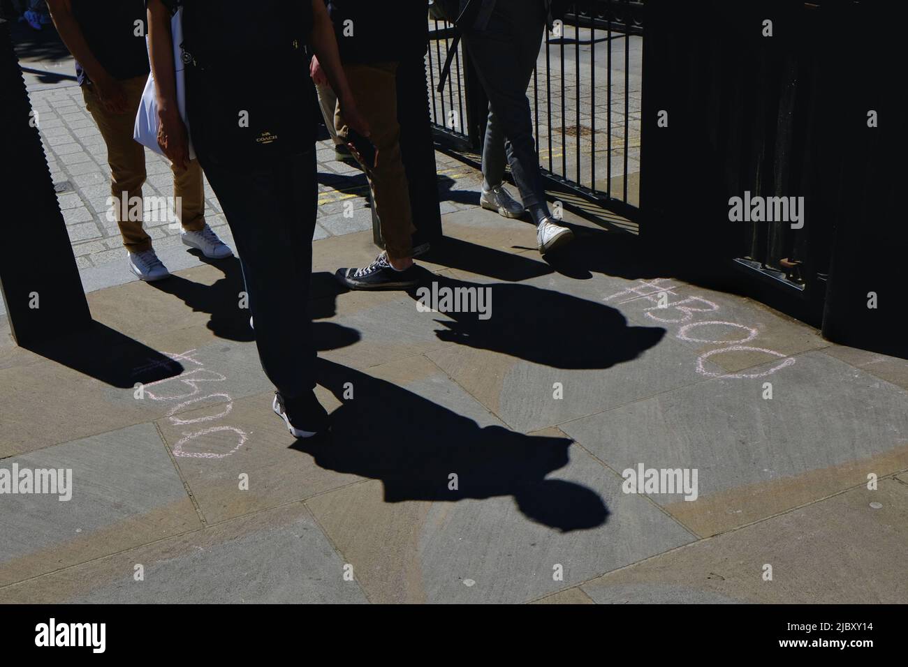 London, UK. Chalked 'Boo's on a pavement in Whitehall in protest of Boris Johnson - who has booed himself following a no-confidence vote Stock Photo