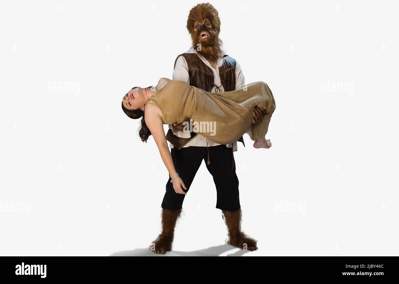 olf holding a dead woman and lover, in his arms with a distraught and sad expression on his face, two people in Halloween costumes on white background Stock Photo