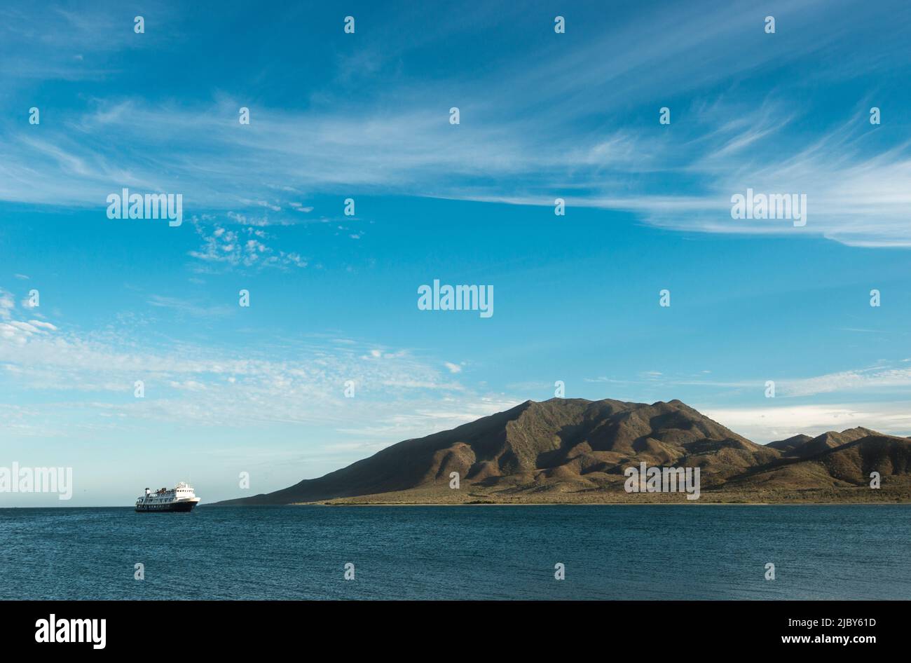 The National Geographic Sea Lion anchored at the horizon near Magdalena