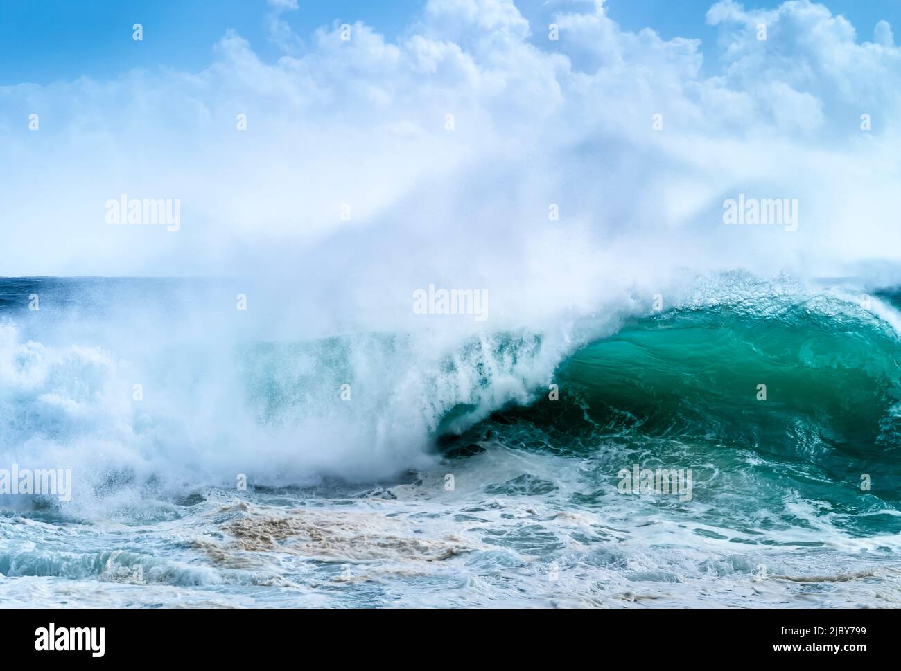 Huge wave curling over and breaking during cyclone Ola Stock Photo