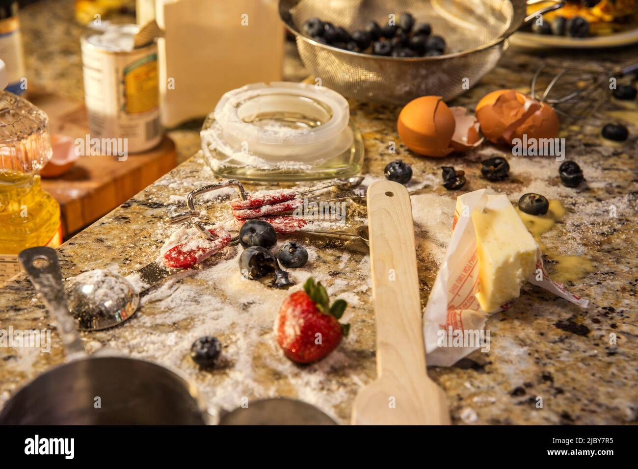Messy kitchen counter after making blueberry pancakes Stock Photo