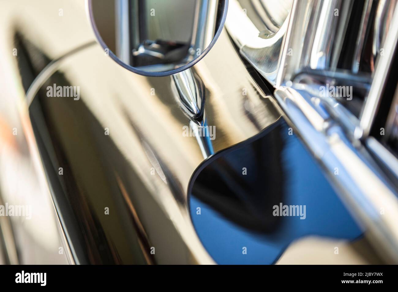 Detail of chrome side mirror on 1960 oldsmobile super 88 holiday sport