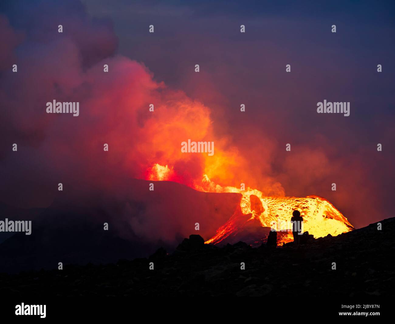 Photographer and glowing lava at twilight, Fagradalsfjall Volcano from ...