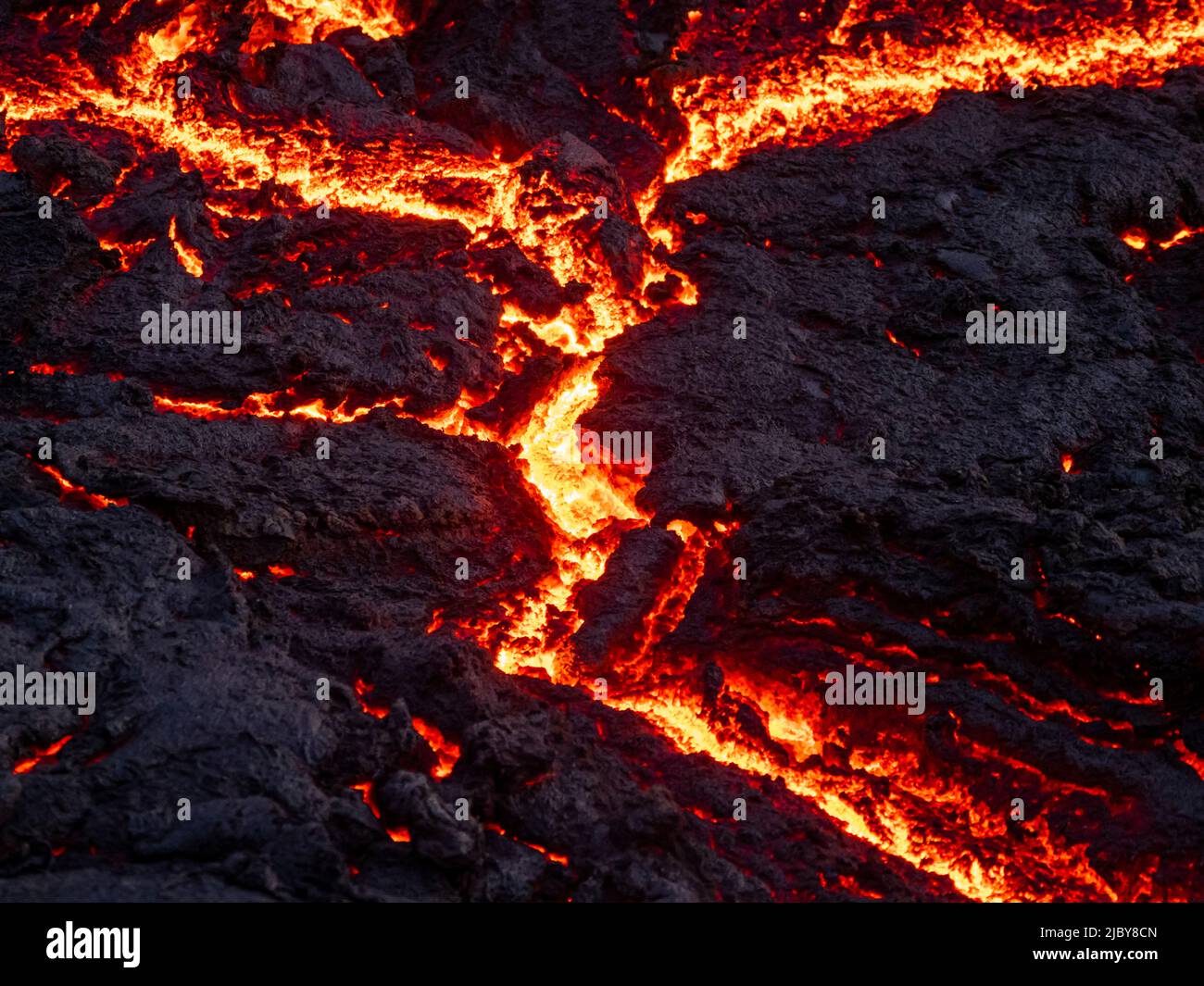 Cracks in lava flow and glowing magma, Fagradalsfjall Volcano, Iceland Stock Photo