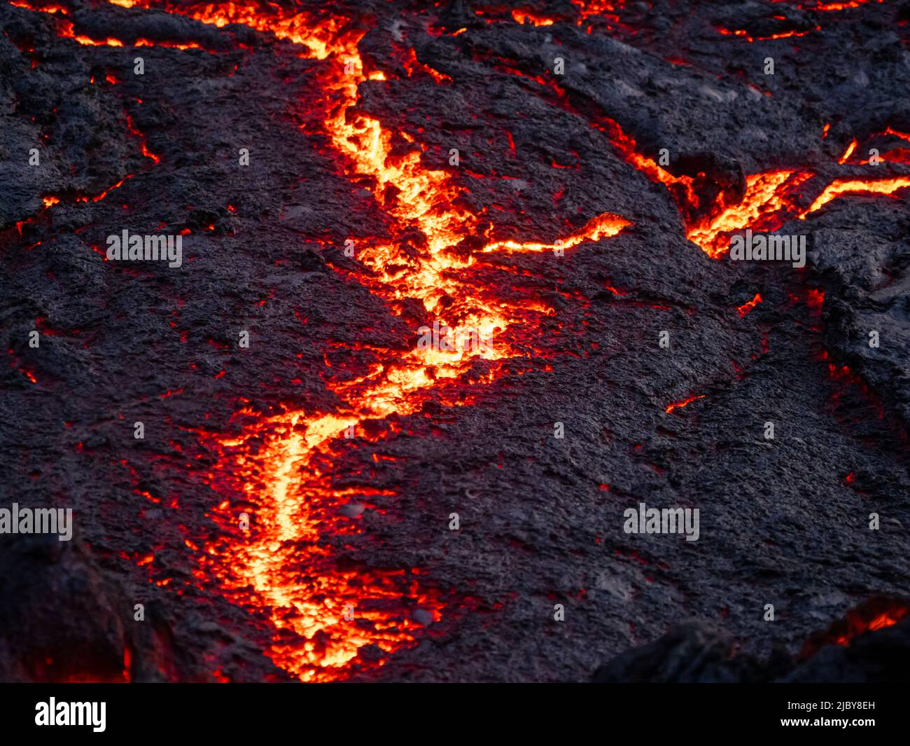 Cracks in lava flow and glowing magma, Fagradalsfjall Volcano, Iceland Stock Photo