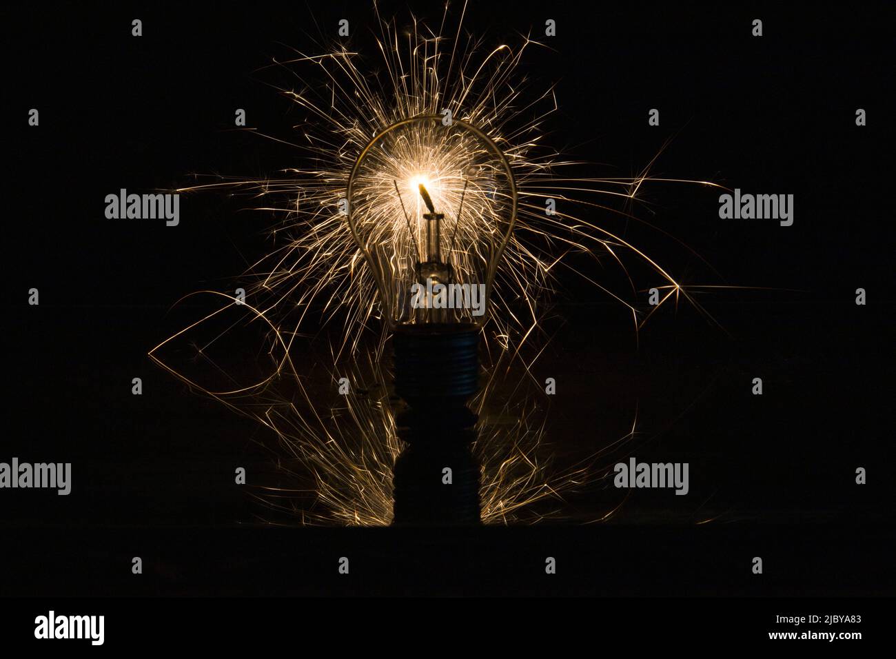 The incandescent lamp burns with sparks Stock Photo Alamy