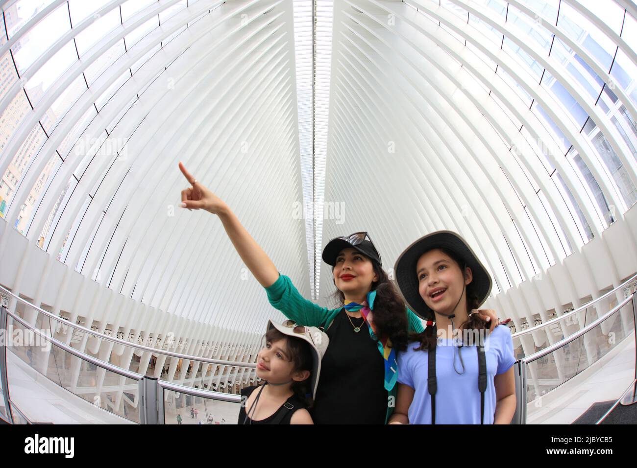 Mother and two daughters visiting The World Trade Center Transportation Hub, The Oculus - Manhattan, New York City - New York, USA. Stock Photo